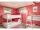 A bright bedroom with twin bunk beds and natural light from the windows at 7039 Otis Ct, Arvada, CO 80003