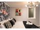 Bedroom with playful rock and roll theme and black and white accents at 7039 Otis Ct, Arvada, CO 80003