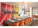 Fun dining room featuring colorful accent wall and space for large gatherings at 7039 Otis Ct, Arvada, CO 80003