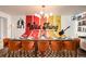 Fun dining room featuring colorful accent wall and space for large gatherings at 7039 Otis Ct, Arvada, CO 80003