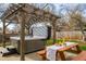 Hot tub with pergola, string lights, and picnic table at 7039 Otis Ct, Arvada, CO 80003