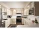 Bright kitchen featuring stainless steel appliances and ample counter space at 7039 Otis Ct, Arvada, CO 80003