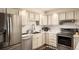 Bright kitchen featuring stainless steel appliances and ample counter space at 7039 Otis Ct, Arvada, CO 80003