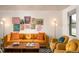 Comfortable living room with a plush sofa and fun and funky wall art at 7039 Otis Ct, Arvada, CO 80003