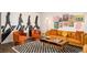 Stylish living room with custom wall art, rug, and well-appointed seating area at 7039 Otis Ct, Arvada, CO 80003