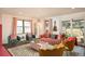 Bright and cozy living room with velvet seating and natural light at 7039 Otis Ct, Arvada, CO 80003
