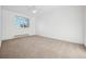 Bright bedroom with carpeted floor and a window offering natural light at 1663 S Yampa Way, Aurora, CO 80017