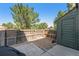 Small backyard with gravel, shed, and wooden fence at 17111 E Stanford Ave # C, Aurora, CO 80015
