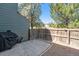 Small backyard with patio, gravel, and wooden fence at 17111 E Stanford Ave # C, Aurora, CO 80015