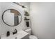 Stylish bathroom with floating vanity and shelves at 17111 E Stanford Ave # C, Aurora, CO 80015