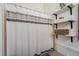 Simple bathroom with shower stall and shelving at 17111 E Stanford Ave # C, Aurora, CO 80015