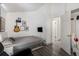 Cozy bedroom with a bed, guitar, and ample wall space at 17111 E Stanford Ave # C, Aurora, CO 80015