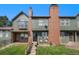 Brick townhouse with a small front yard and steps leading to the entrance at 17111 E Stanford Ave # C, Aurora, CO 80015