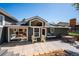 Back of house showing patio area and windows at 6995 S Kendall Blvd, Littleton, CO 80128