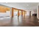 Large basement with wood accents, staircase, recessed lights, and dark flooring, ready for customization at 6995 S Kendall Blvd, Littleton, CO 80128