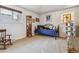 Bedroom displaying an iron daybed and windows with natural light at 6995 S Kendall Blvd, Littleton, CO 80128