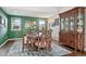 Elegant dining room with hardwood floors and a classic china cabinet at 6995 S Kendall Blvd, Littleton, CO 80128