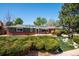 Charming single-story home with brick accents, skylights, and mature landscaping at 6995 S Kendall Blvd, Littleton, CO 80128