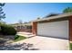 Exterior view of home showing the garage, front porch, and brick details at 6995 S Kendall Blvd, Littleton, CO 80128