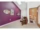 Hallway featuring a purple accent wall and a skylight at 6995 S Kendall Blvd, Littleton, CO 80128