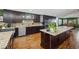 Gourmet kitchen with granite countertops, stainless steel appliances, and a center island at 6995 S Kendall Blvd, Littleton, CO 80128