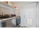 Laundry room featuring a full-size washer and dryer at 6995 S Kendall Blvd, Littleton, CO 80128