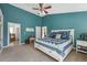 Bedroom featuring a vaulted ceiling, a comfortable bed, and an ensuite bathroom at 6995 S Kendall Blvd, Littleton, CO 80128