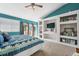 Bedroom featuring a vaulted ceiling, a built-in entertainment center, and sliding glass doors to a private balcony at 6995 S Kendall Blvd, Littleton, CO 80128