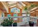 Sunroom with vaulted wood ceiling, skylights, and chandelier lighting at 6995 S Kendall Blvd, Littleton, CO 80128