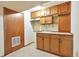 Small basement kitchenette with wood cabinets at 2325 15Th Ave, Longmont, CO 80503