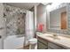 Bathroom with patterned tile and a shower/tub combo at 2325 15Th Ave, Longmont, CO 80503
