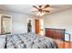 Spacious bedroom with hardwood floors, ceiling fan and ensuite bathroom at 2325 15Th Ave, Longmont, CO 80503