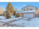 Two-story house with attached garage and snow-covered front yard at 2325 15Th Ave, Longmont, CO 80503