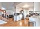 Modern kitchen with stainless steel appliances, white cabinets, and hardwood floors at 2325 15Th Ave, Longmont, CO 80503
