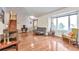 Hardwood floor living room with a couch, chair, and view into the entryway at 2325 15Th Ave, Longmont, CO 80503