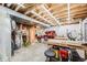 Spacious basement featuring a functional workshop area with ample lighting and storage solutions at 2226 Weatherstone Cir, Highlands Ranch, CO 80126