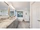 Bathroom features double vanity, large soaking tub, and a tiled shower behind a glass door at 2226 Weatherstone Cir, Highlands Ranch, CO 80126