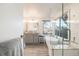 Bright bathroom with a soaking tub, frameless shower, dual vanity, and wood-look tile floors at 2226 Weatherstone Cir, Highlands Ranch, CO 80126