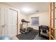 Basement gym with treadmill and exercise equipment at 2226 Weatherstone Cir, Highlands Ranch, CO 80126