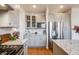 A well-appointed kitchen features gray cabinets, granite countertops, and stainless steel appliances at 2226 Weatherstone Cir, Highlands Ranch, CO 80126