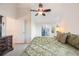 Vaulted ceilings, neutral carpet, and sliding glass doors to a balcony enhance this main bedroom suite at 2226 Weatherstone Cir, Highlands Ranch, CO 80126