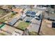 Overhead view of a house with solar panels, a fenced yard, gravel area and a grassy area at 7621 Granada Rd, Denver, CO 80221