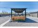 Backyard featuring custom outdoor kitchen and dining area at 7621 Granada Rd, Denver, CO 80221