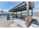 Backyard featuring custom outdoor kitchen and dining area at 7621 Granada Rd, Denver, CO 80221