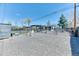 Backyard with gravel area, outdoor seating, grassy area, and plenty of space for outdoor activities at 7621 Granada Rd, Denver, CO 80221