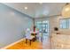 Dining area showcases a modern table and chairs near the kitchen at 7621 Granada Rd, Denver, CO 80221