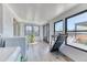 Bright laundry room with lots of windows and backyard views at 7621 Granada Rd, Denver, CO 80221