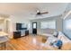 Cozy living room features hardwood floors, neutral walls, and ample natural light at 7621 Granada Rd, Denver, CO 80221