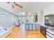 Open-concept living space boasts hardwood floors and seamless flow to the dining and kitchen areas at 7621 Granada Rd, Denver, CO 80221