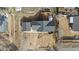 Aerial view of the house with a detached garage, well-maintained roof and surrounding landscape at 3230 S Decatur St, Denver, CO 80236